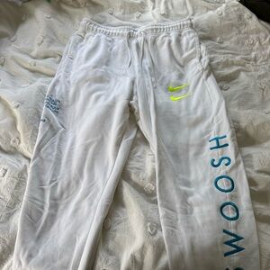 Nike Kids White Joggers with Neon Yellow and Blue Details